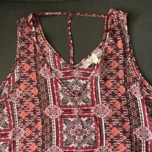 Beautiful woman’s dress or casual tank top with thin T back v neck design.